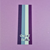 Bookmark with asexual flag and text that reads 'out of fucks'.