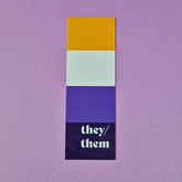 Bookmark with non-binary flag and text that reads 'they/them'.
