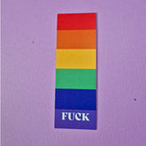 Bookmark with pride flag with text that reads 'FUCK'.