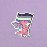A sticker that has a cute dragon carrying a asexual pride flag. This pride sticker makes a great gift