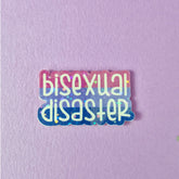 A holographic finish sticker that reads bisexual disaster and has the bi flag colours behind the text. This pride sticker makes a great gift.
