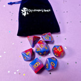 Set of bisexual: rose pink, purple and blue dice with a velvet blue drawstring bag. A great gift to play dungeon and dragons with or any other ttrpg.