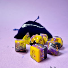 Set of non-binary: purple, yellow and white dice with a velvet blue drawstring bag. A great gift to play dungeon and dragons with or any other ttrpg.
