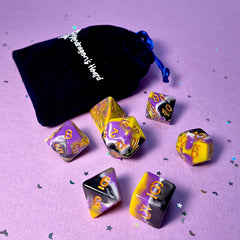 Set of non-binary: purple, yellow and white dice with a velvet blue drawstring bag. A great gift to play dungeon and dragons with or any other ttrpg.
