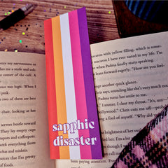 Bookmark with lesbian flag and text that reads 'sapphic disaster'.