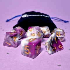 Set of asexual: purple,grey and white dice with a velvet blue drawstring bag. A great gift to play dungeon and dragons with or any other ttrpg.