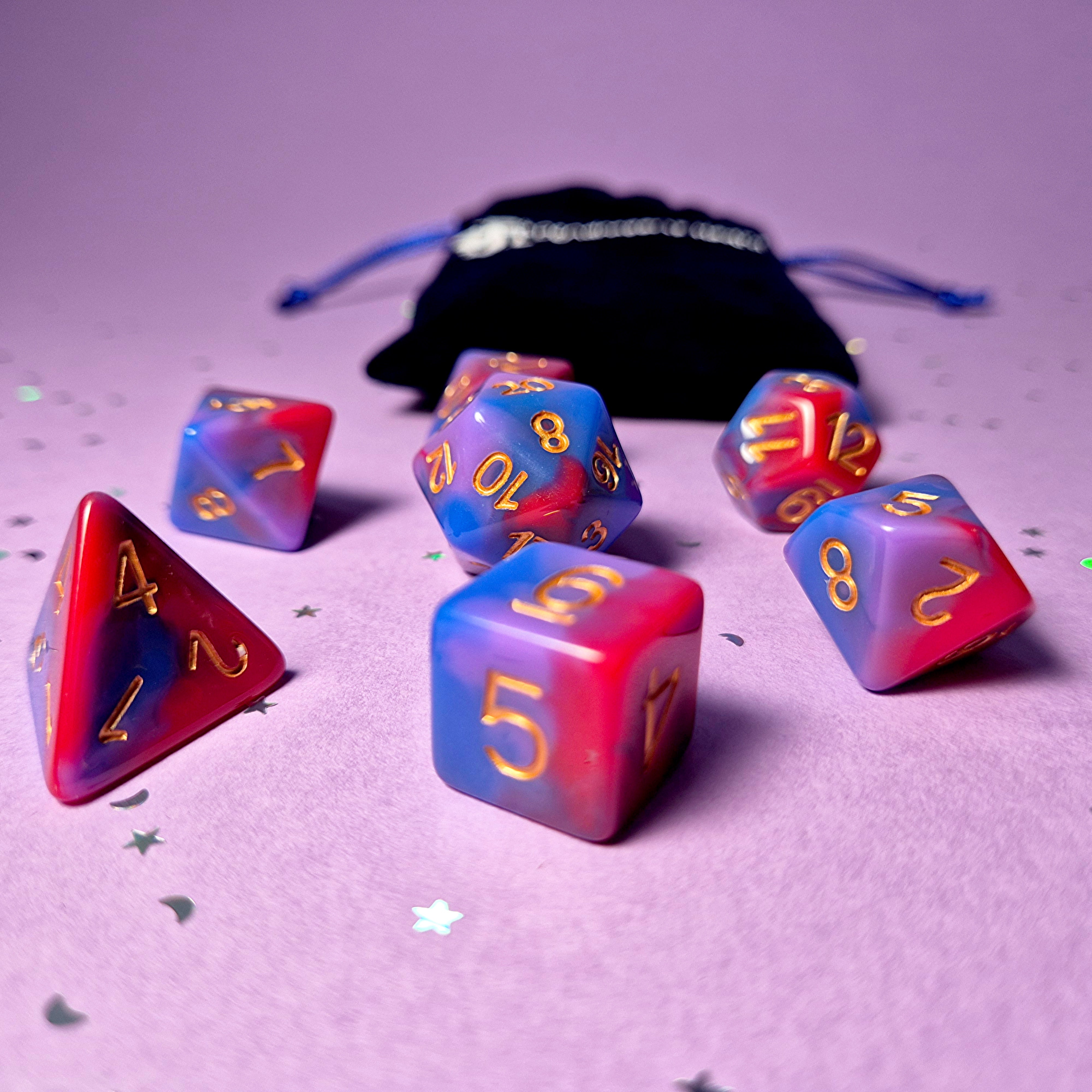 Set of bisexual: rose pink, purple and blue dice with a velvet blue drawstring bag. A great gift to play dungeon and dragons with or any other ttrpg.