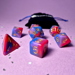 Set of bisexual: rose pink, purple and blue dice with a velvet blue drawstring bag. A great gift to play dungeon and dragons with or any other ttrpg.