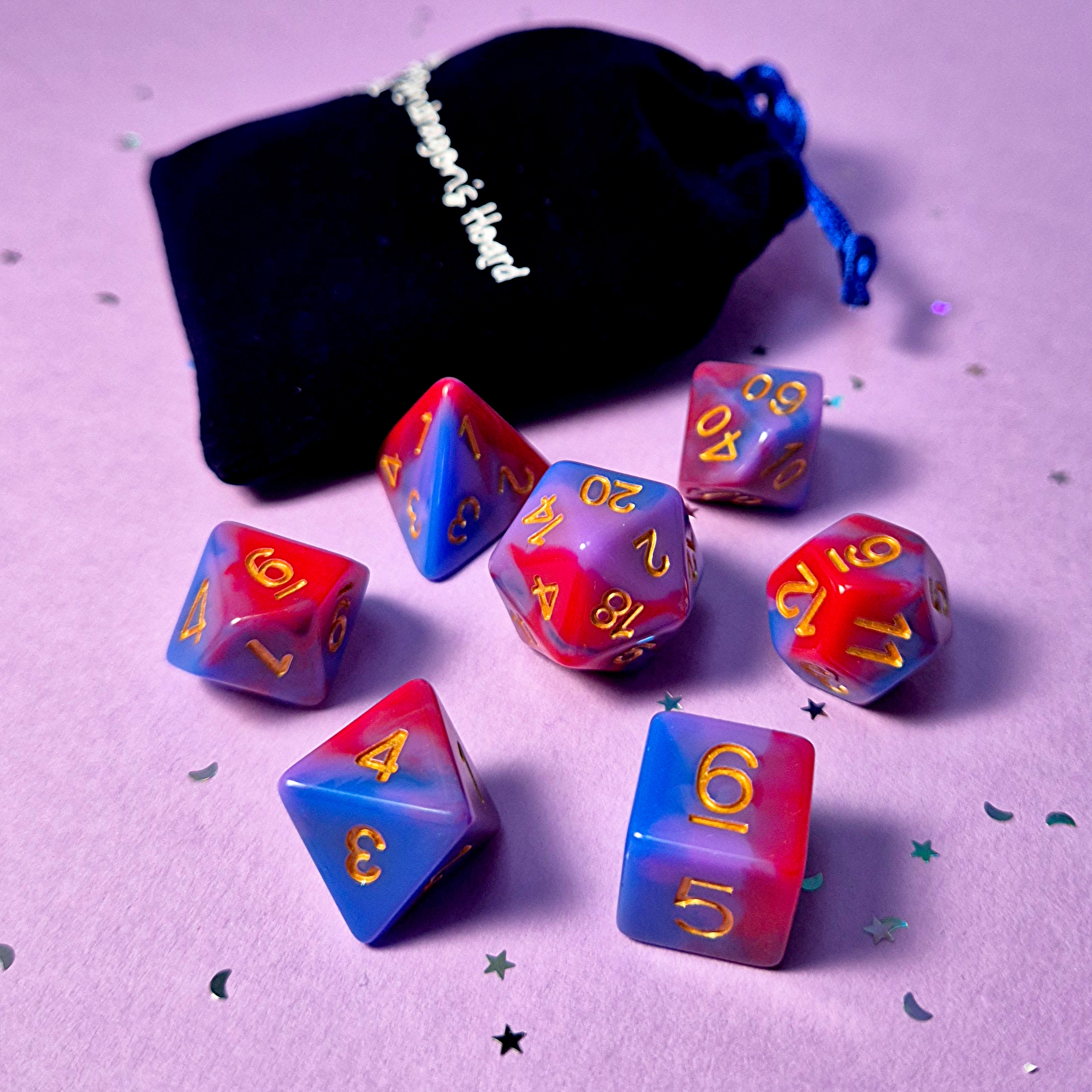 Set of bisexual: rose pink, purple and blue dice with a velvet blue drawstring bag. A great gift to play dungeon and dragons with or any other ttrpg.