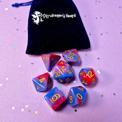 Set of bisexual: rose pink, purple and blue dice with a velvet blue drawstring bag. A great gift to play dungeon and dragons with or any other ttrpg.