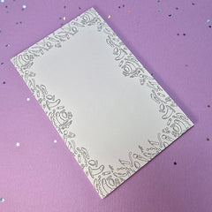 Memo pad with decorative border with a variety of sex toys on it; rabbit, dildo, anal beads, butt plug, vibrator and more