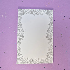 Memo pad with decorative border with a variety of sex toys on it; rabbit, dildo, anal beads, butt plug, vibrator and more