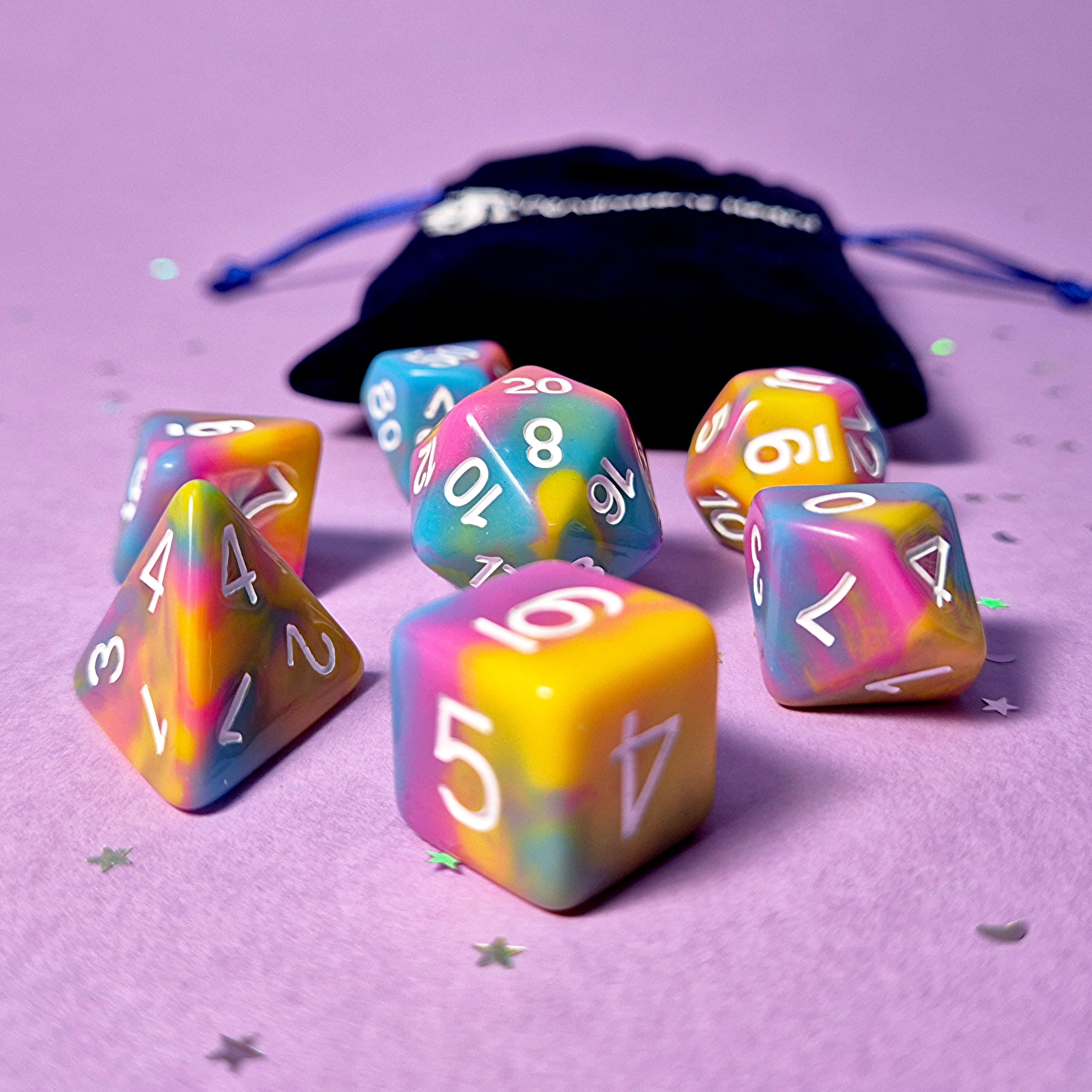 Set of pansexual: pink, yellow and blue dice with a velvet blue drawstring bag. A great gift to play dungeon and dragons with or any other ttrpg.